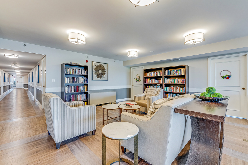 Cozy common area with bookshelves and comfortable seating