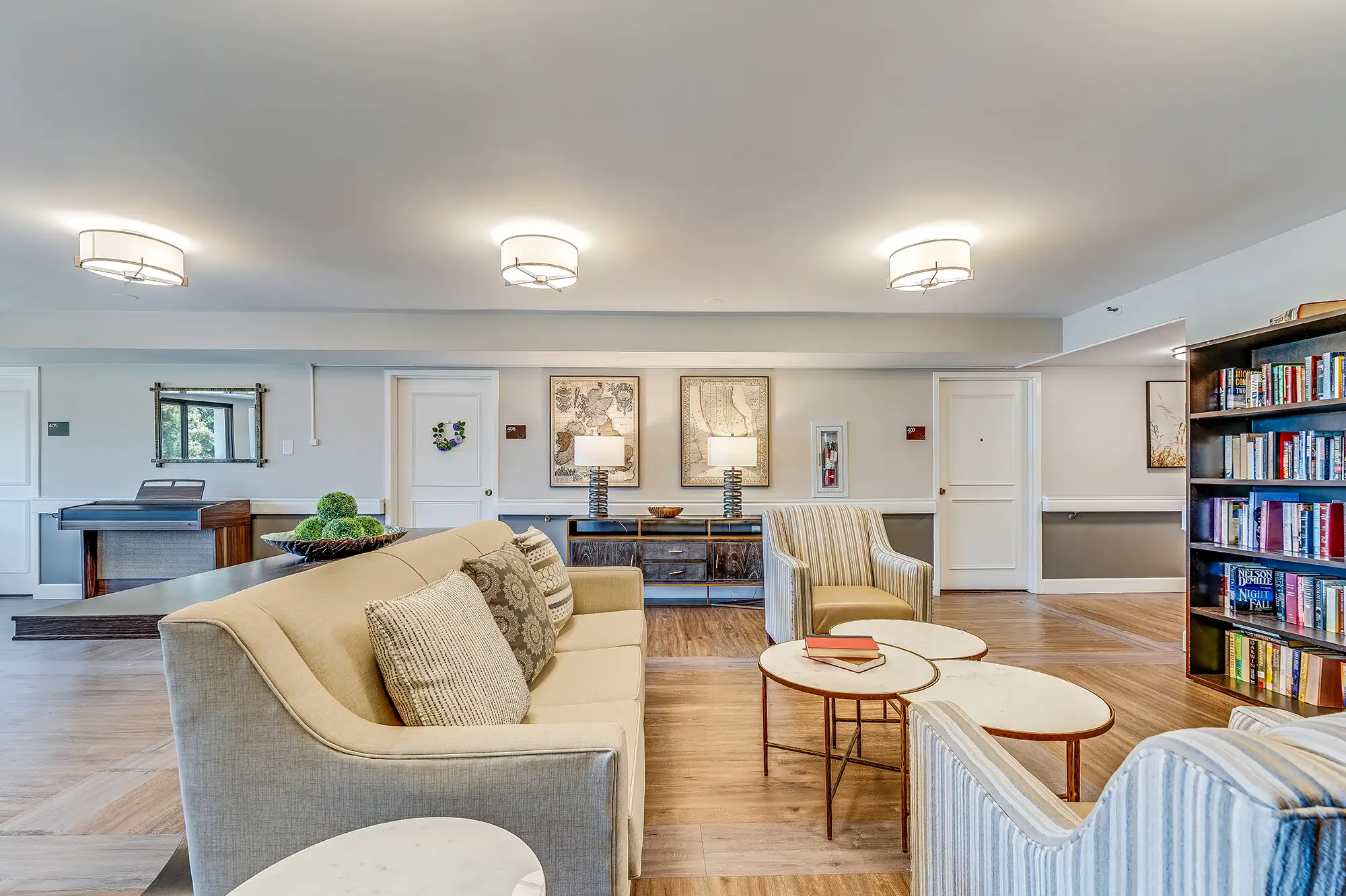 Interior common area with seating and bookshelf