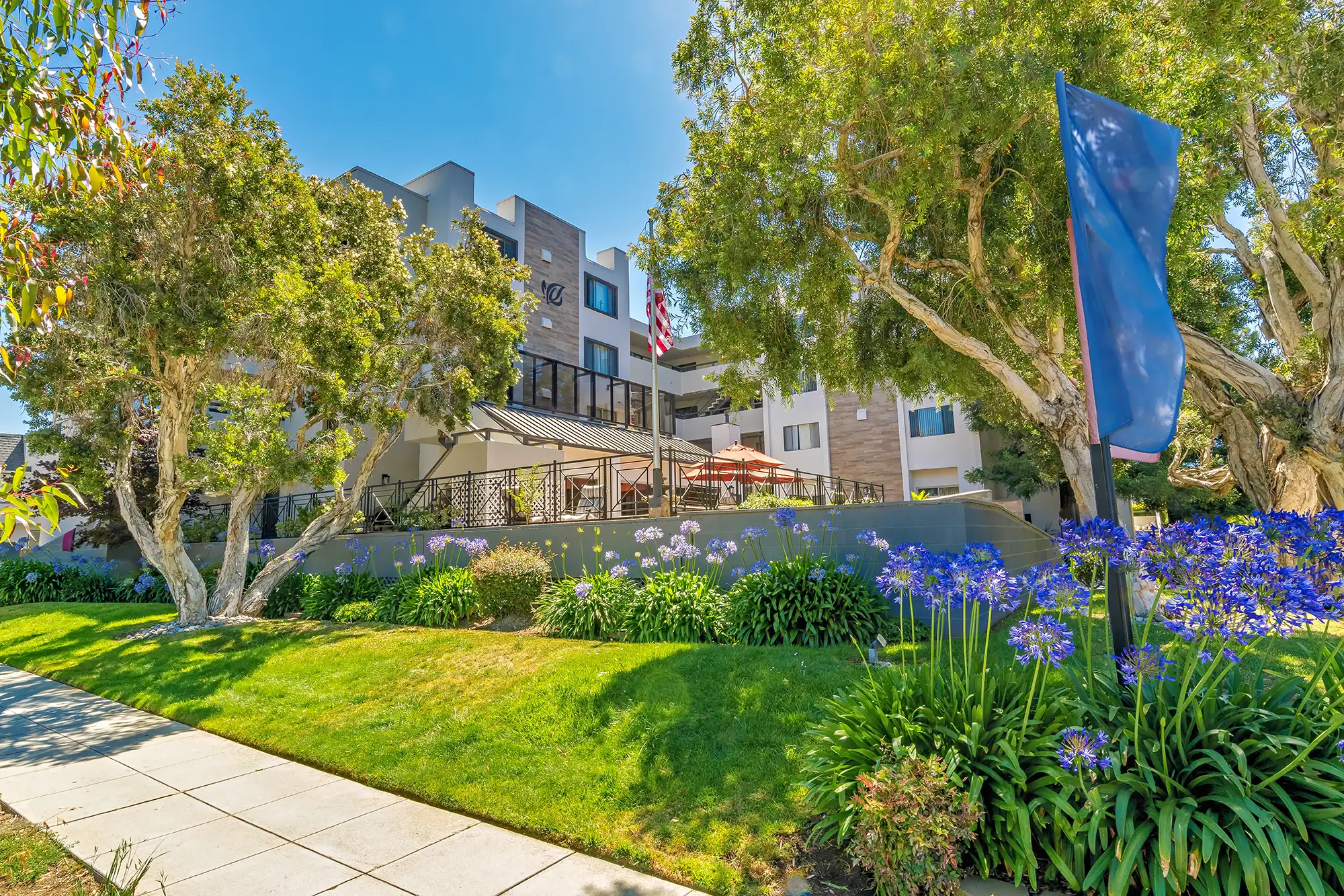 Exterior view of Burlingame Senior Living with gardens