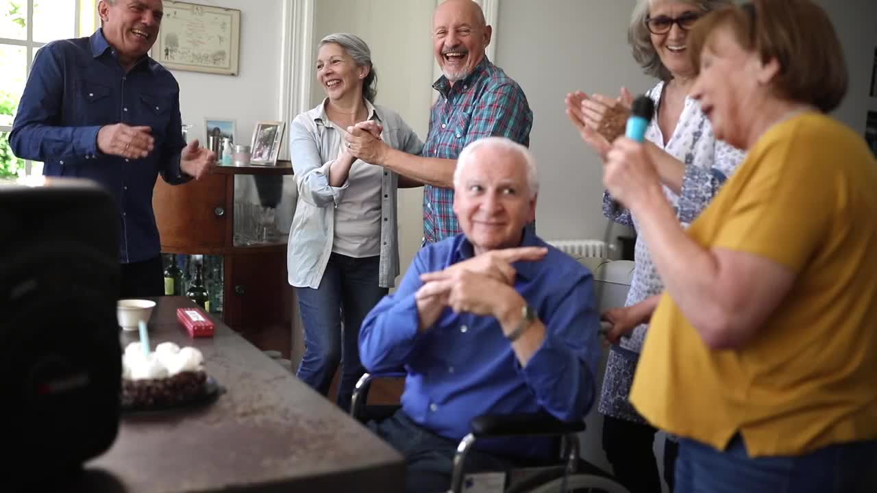 Residents celebrating with cake in a common area
