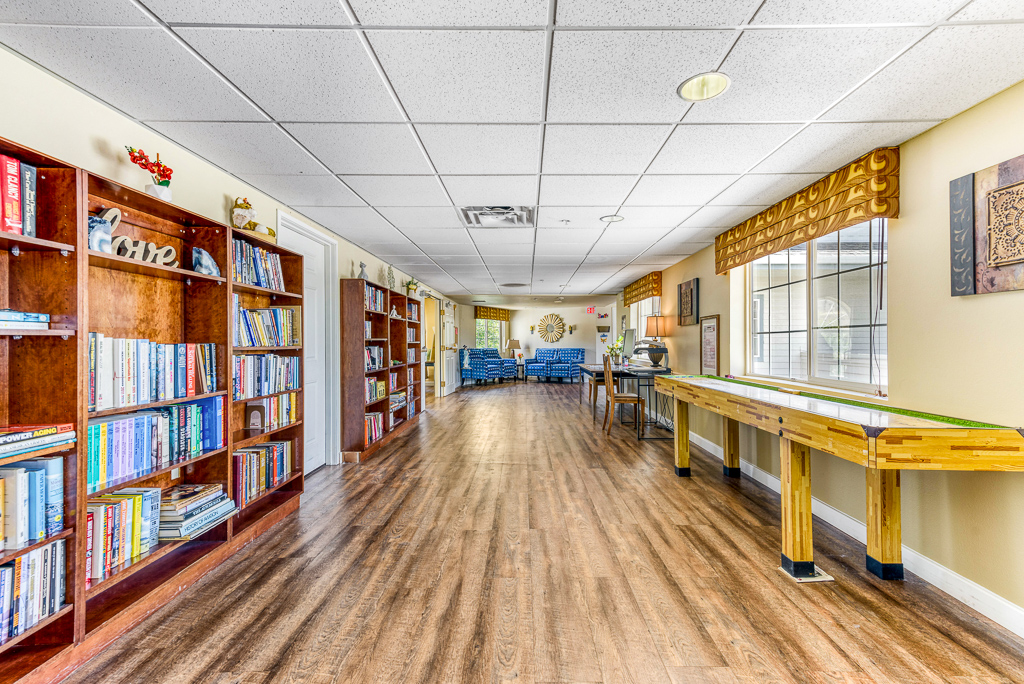 Interior view of a common area with bookshelves and seating