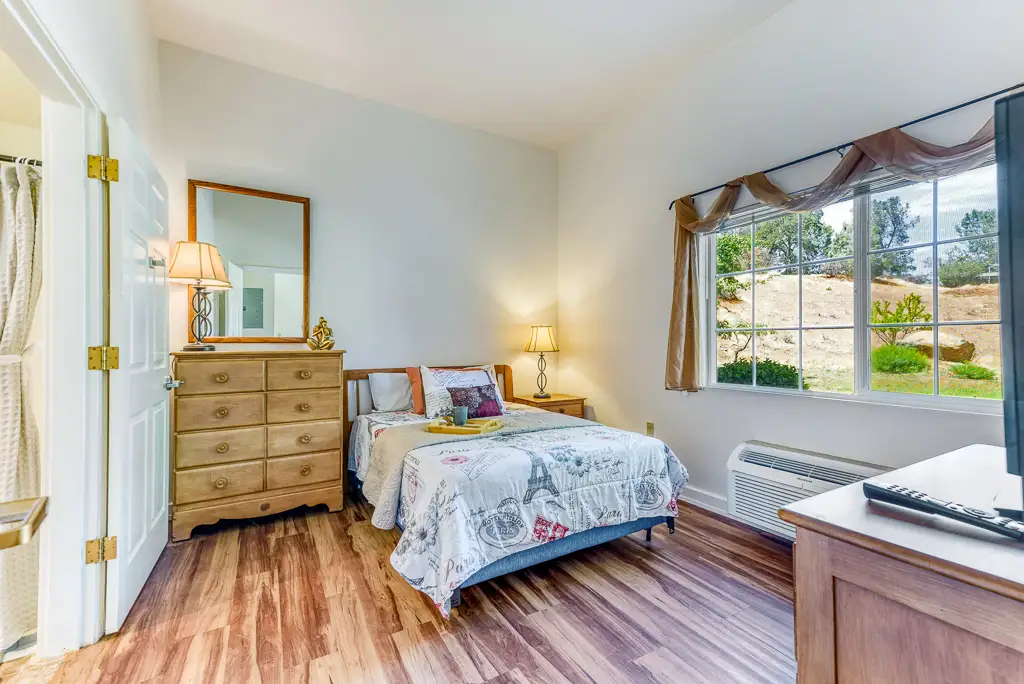 Cozy private resident room with a bed and window view