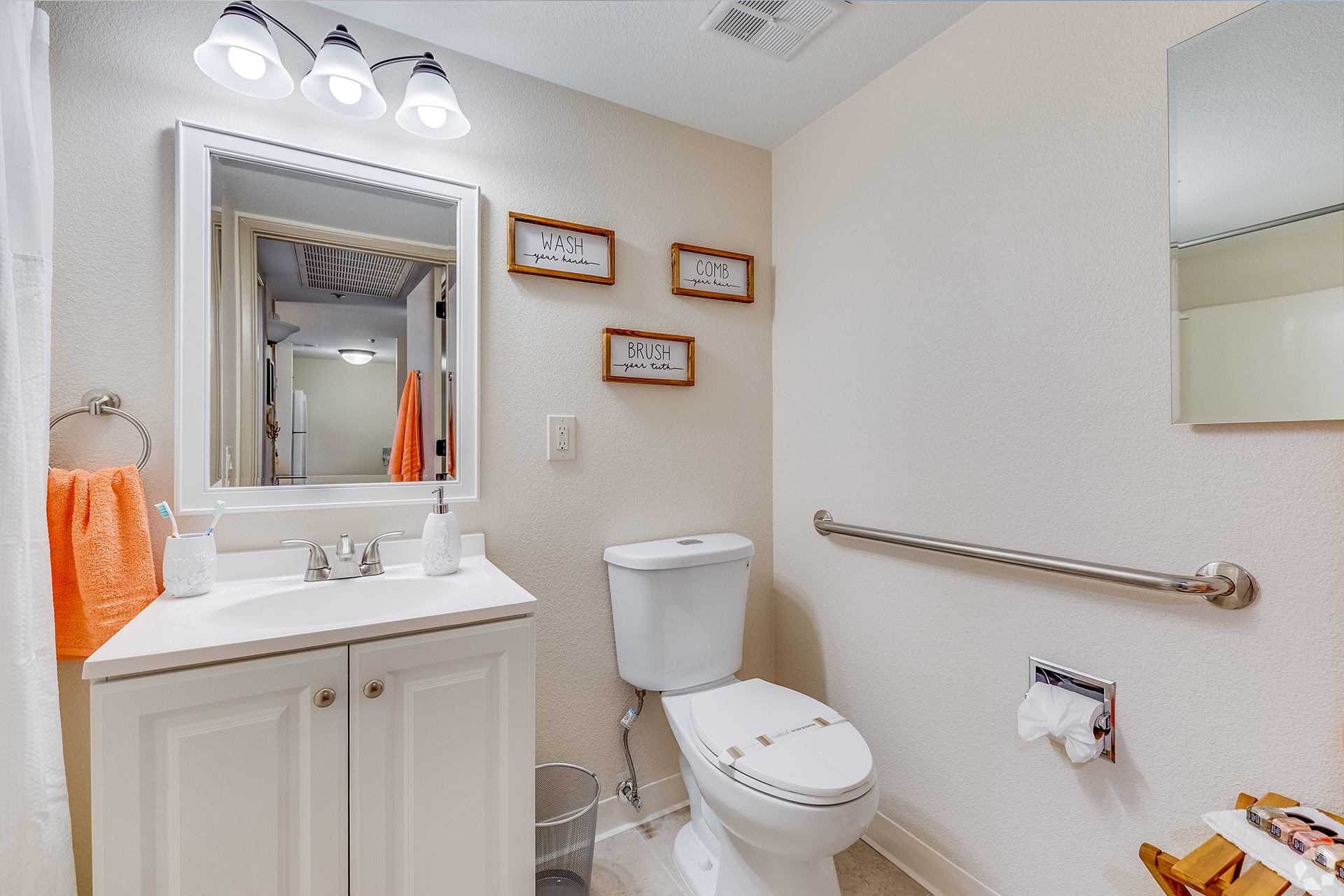 A clean bathroom with sink and toilet facilities