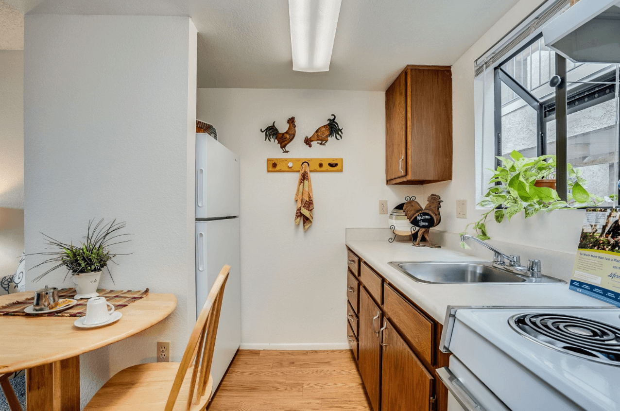 Bright kitchen space with wooden cabinets and decor