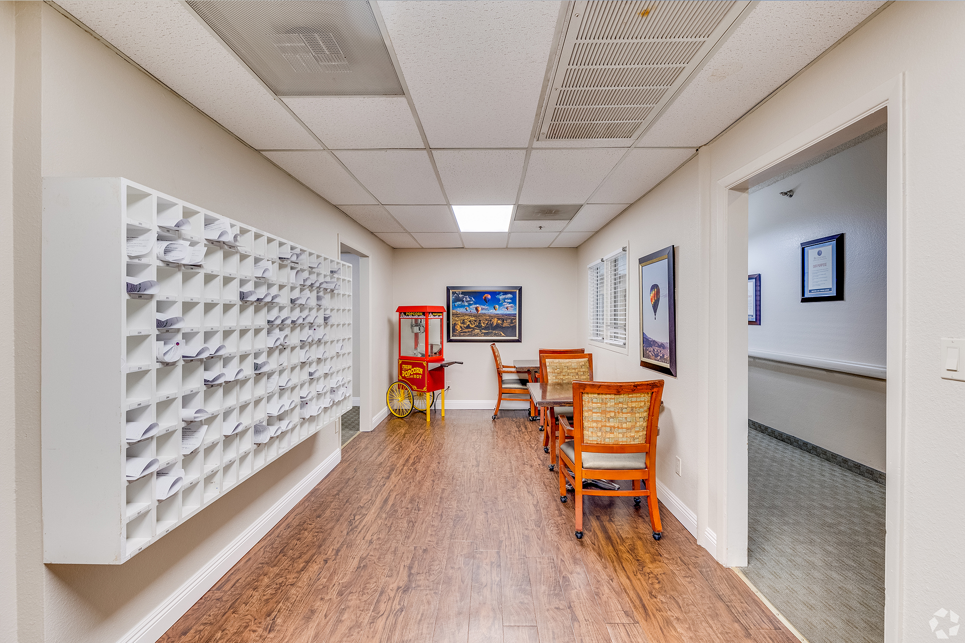 A bright interior hallway with seating and decor