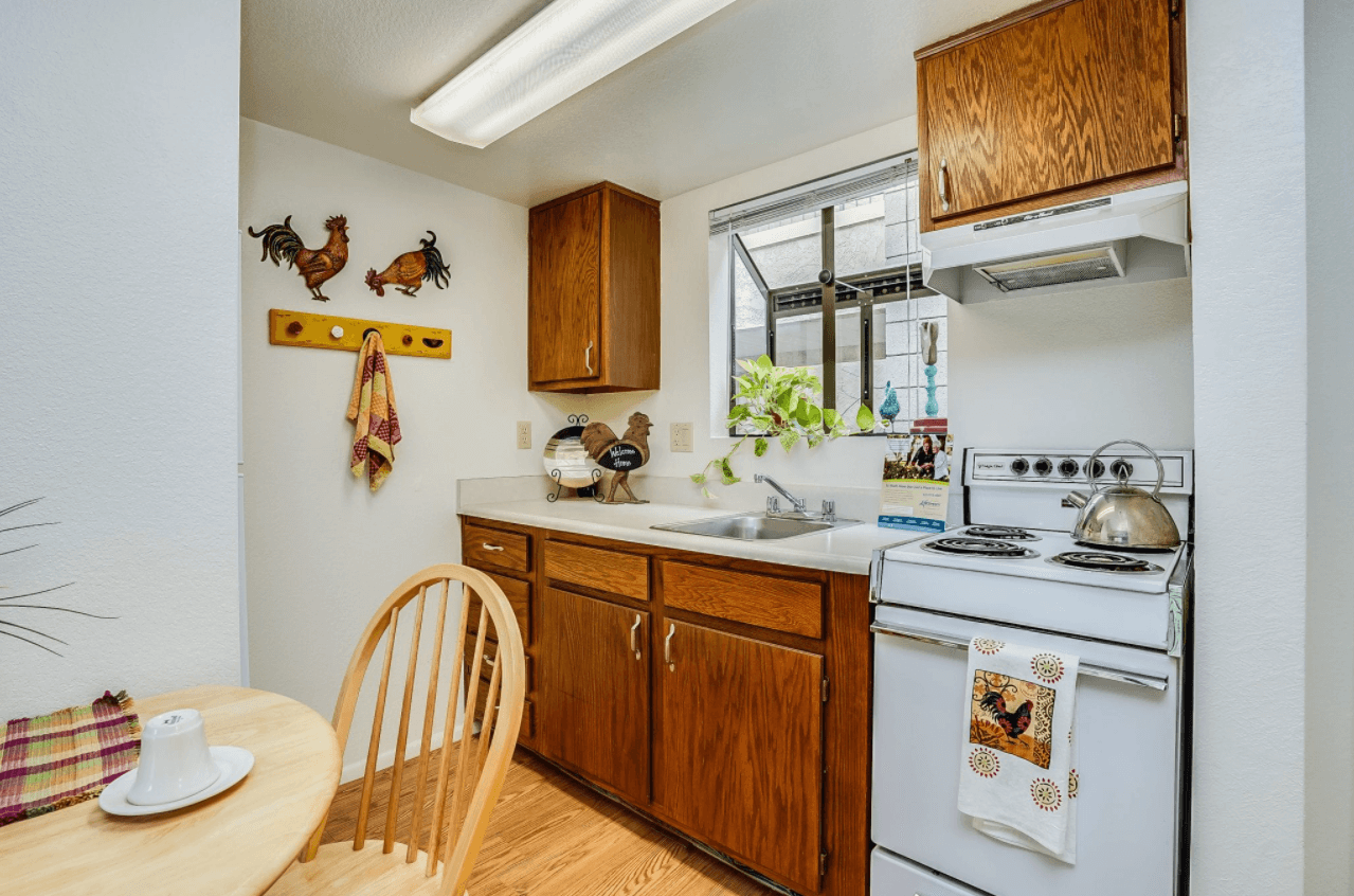 Cozy kitchen area with wooden cabinets and decor