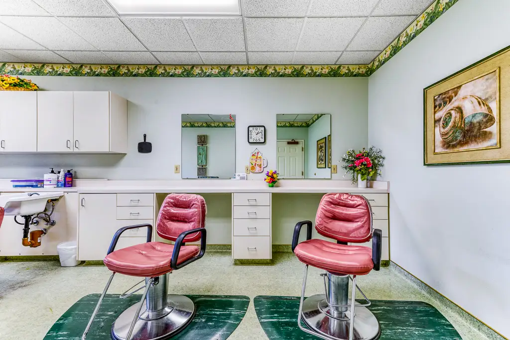 Beauty salon area with styling chairs and mirrors