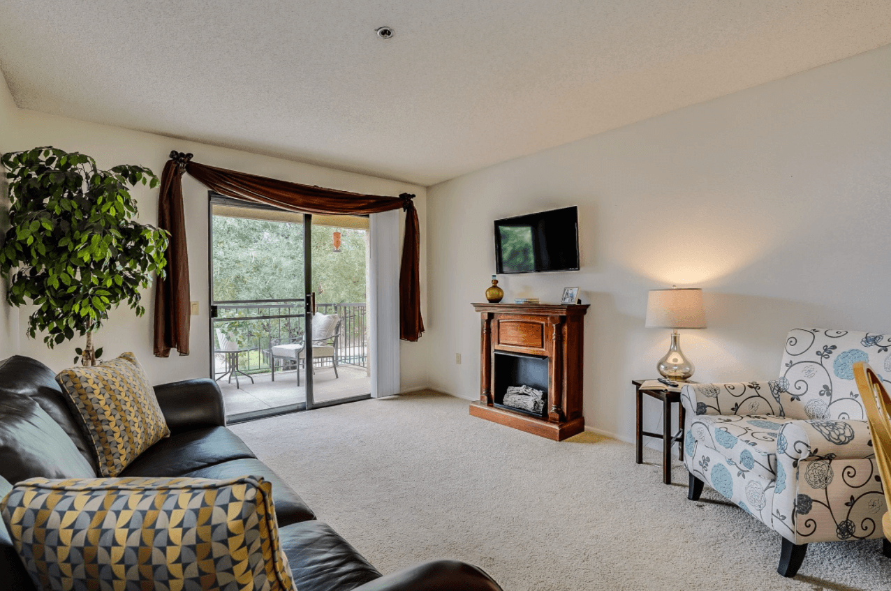 A cozy living room in a resident unit with natural light