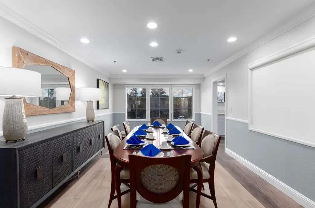 Dining room set for a meal with blue decorations