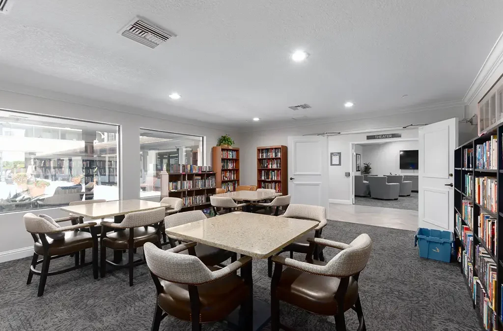 Common area with tables and bookshelves