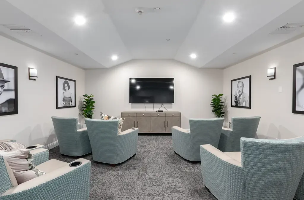 Common lounge area with chairs and a TV