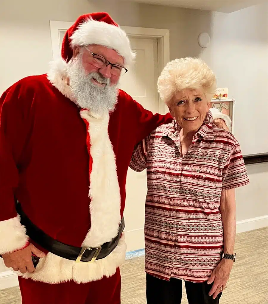 Santa Claus with a resident during a holiday celebration