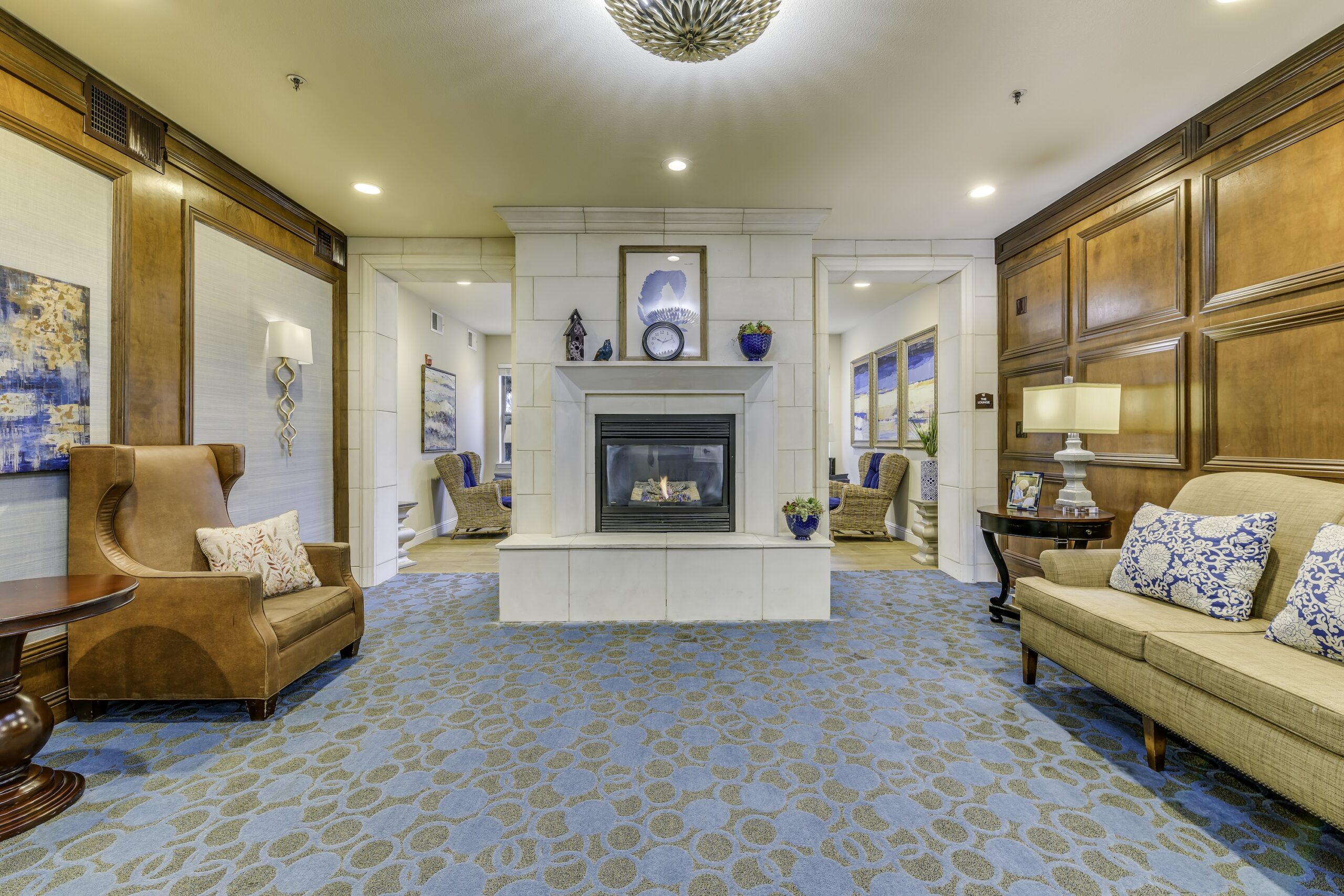Cozy common area with seating and a fireplace