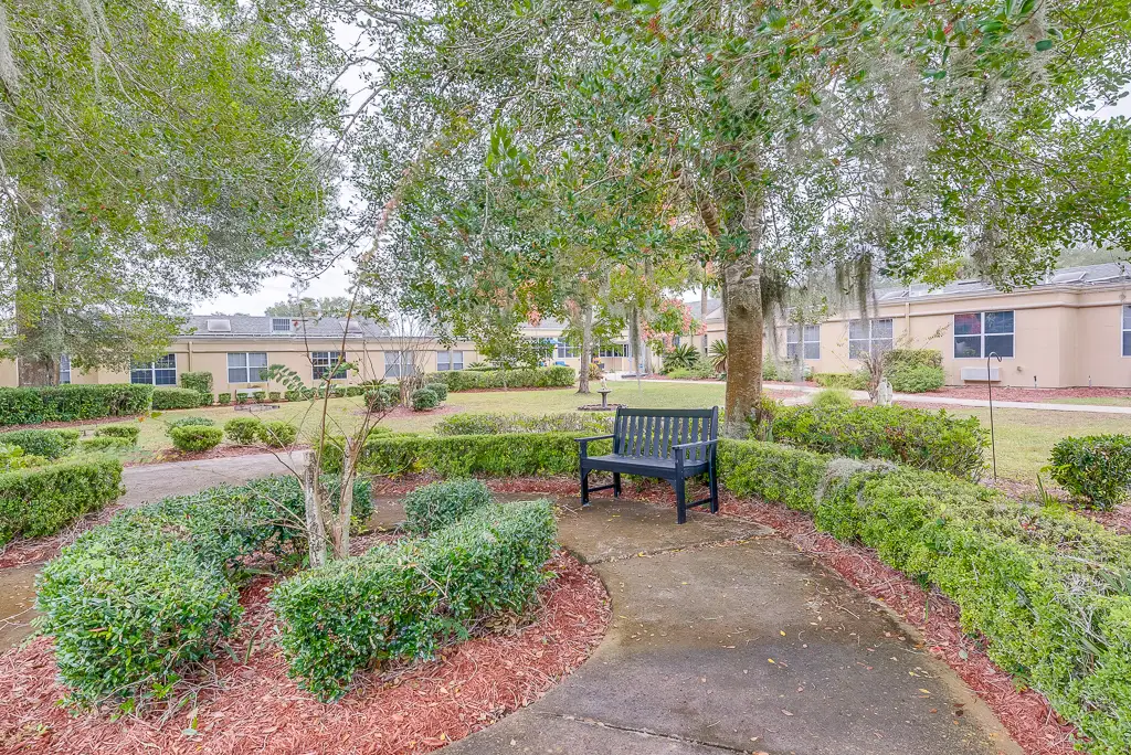 Garden pathway with seating in a senior living facility
