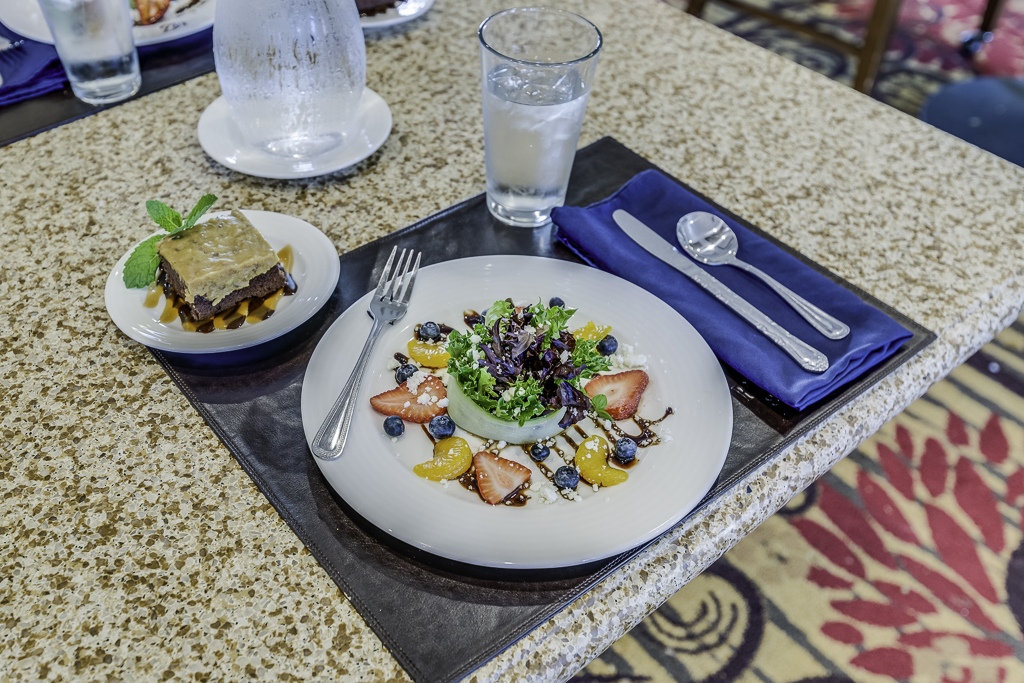 Well-presented meal with dessert in a dining setting