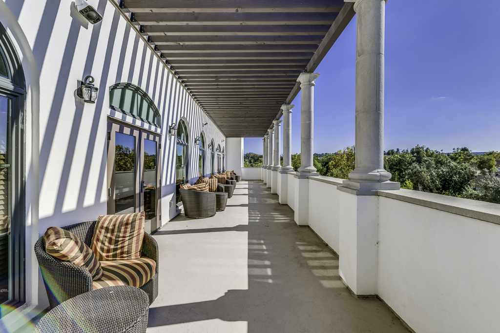 A sunny outdoor patio area with comfortable seating