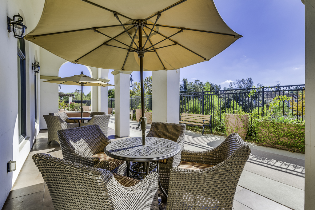 Outdoor patio seating with umbrellas and plants