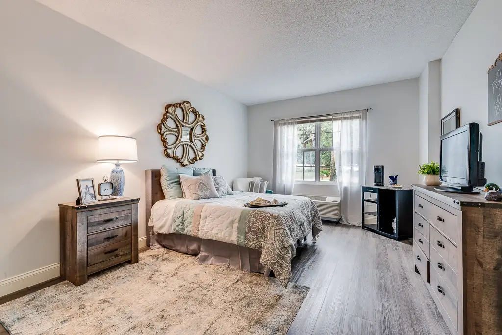 Cozy private resident room with a bed and TV
