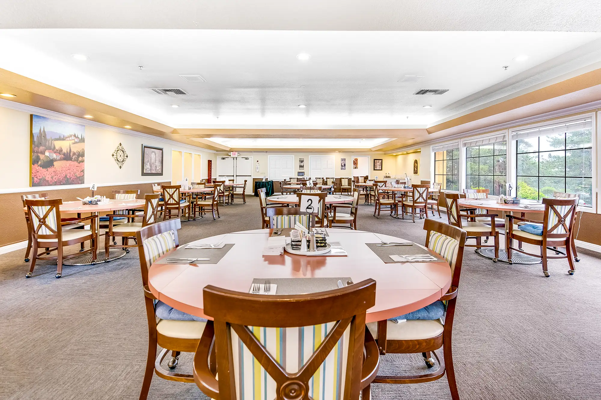 Dining room setup with tables and chairs