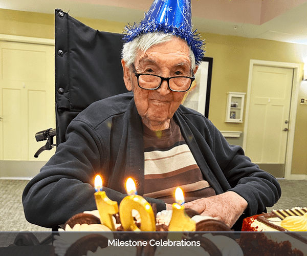 Resident celebrating a milestone birthday with cake