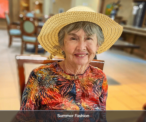 Resident wearing a stylish hat in a facility common area.