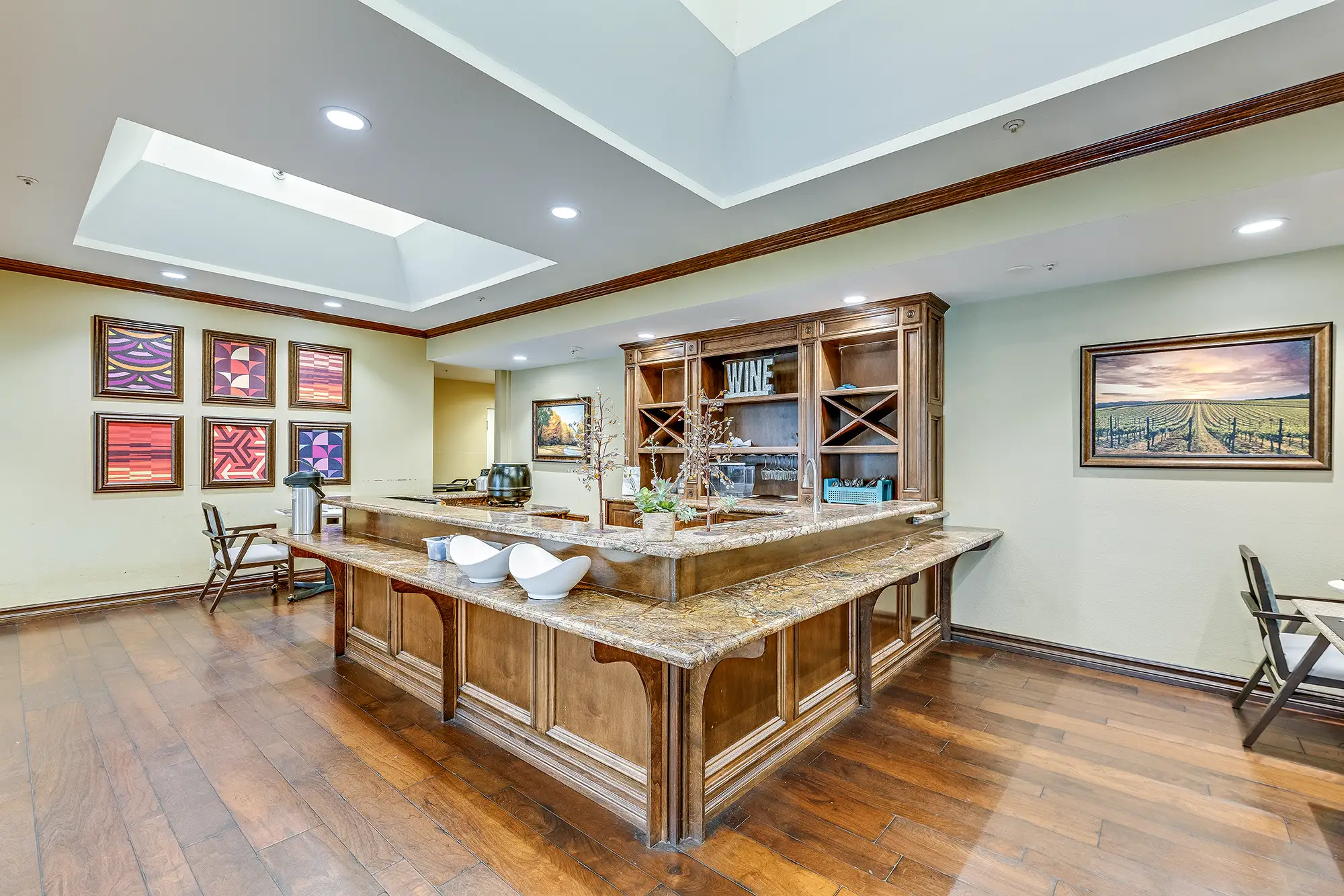 Common area with a wooden counter and art on the walls