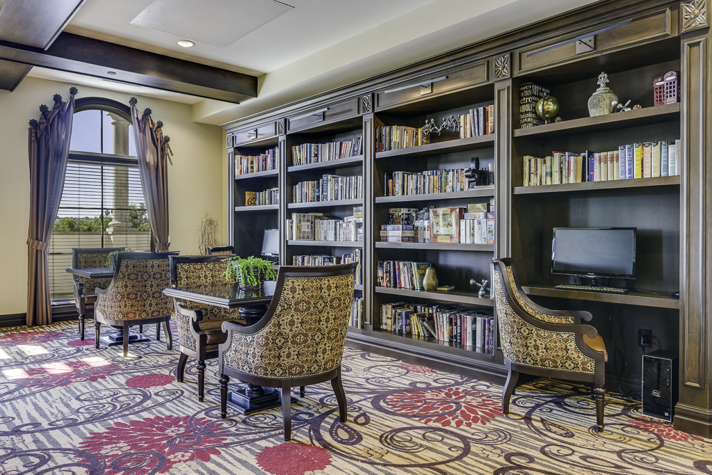 Interior common area with bookshelves and seating