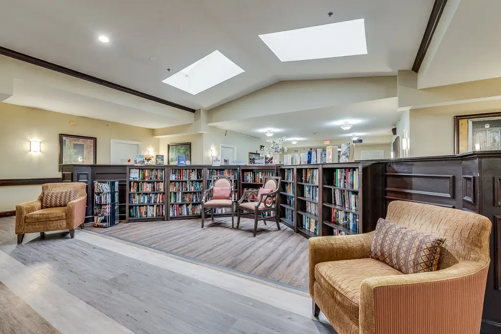 Bright common area with bookshelves and seating