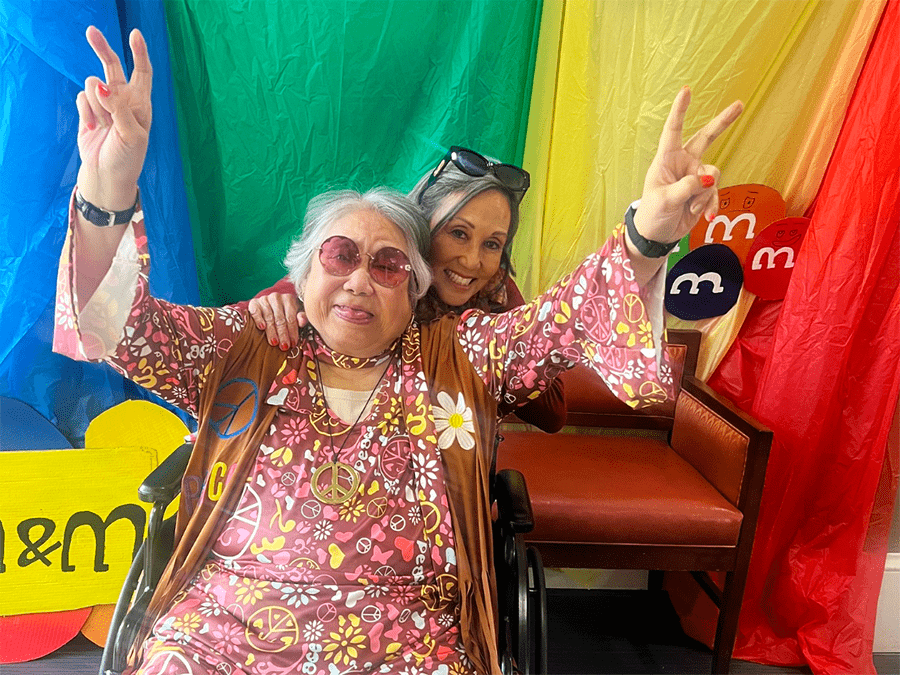 Residents enjoying a fun activity together with peace signs