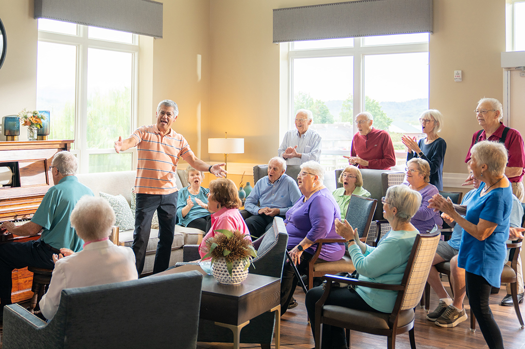 Residents enjoying a music performance in a common area