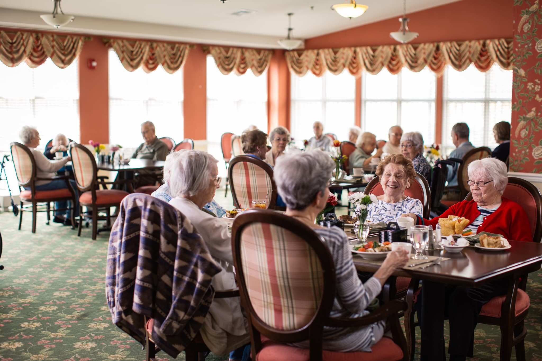 Residents enjoying a meal in the dining room