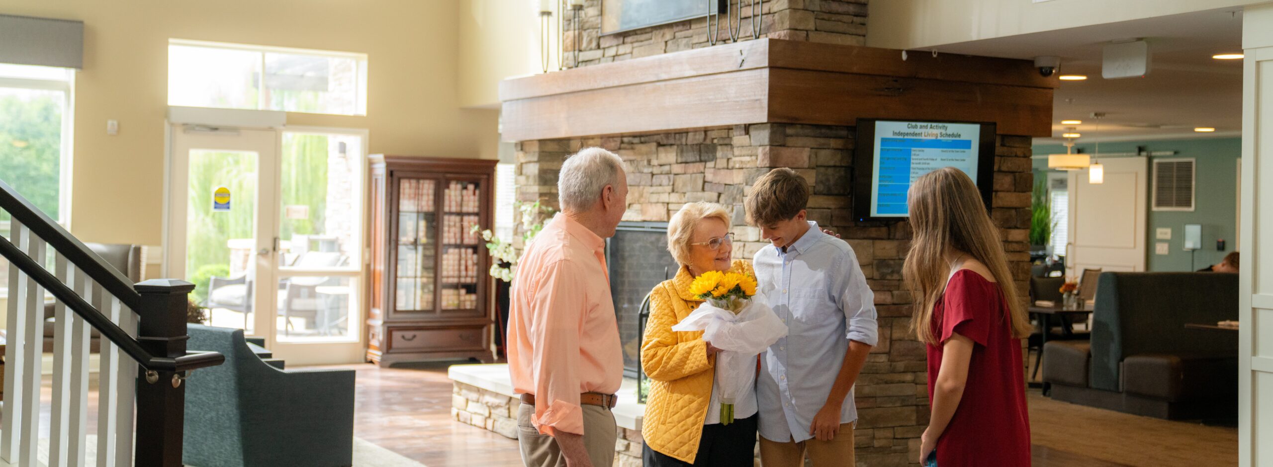 Residents and family members interacting in a communal space