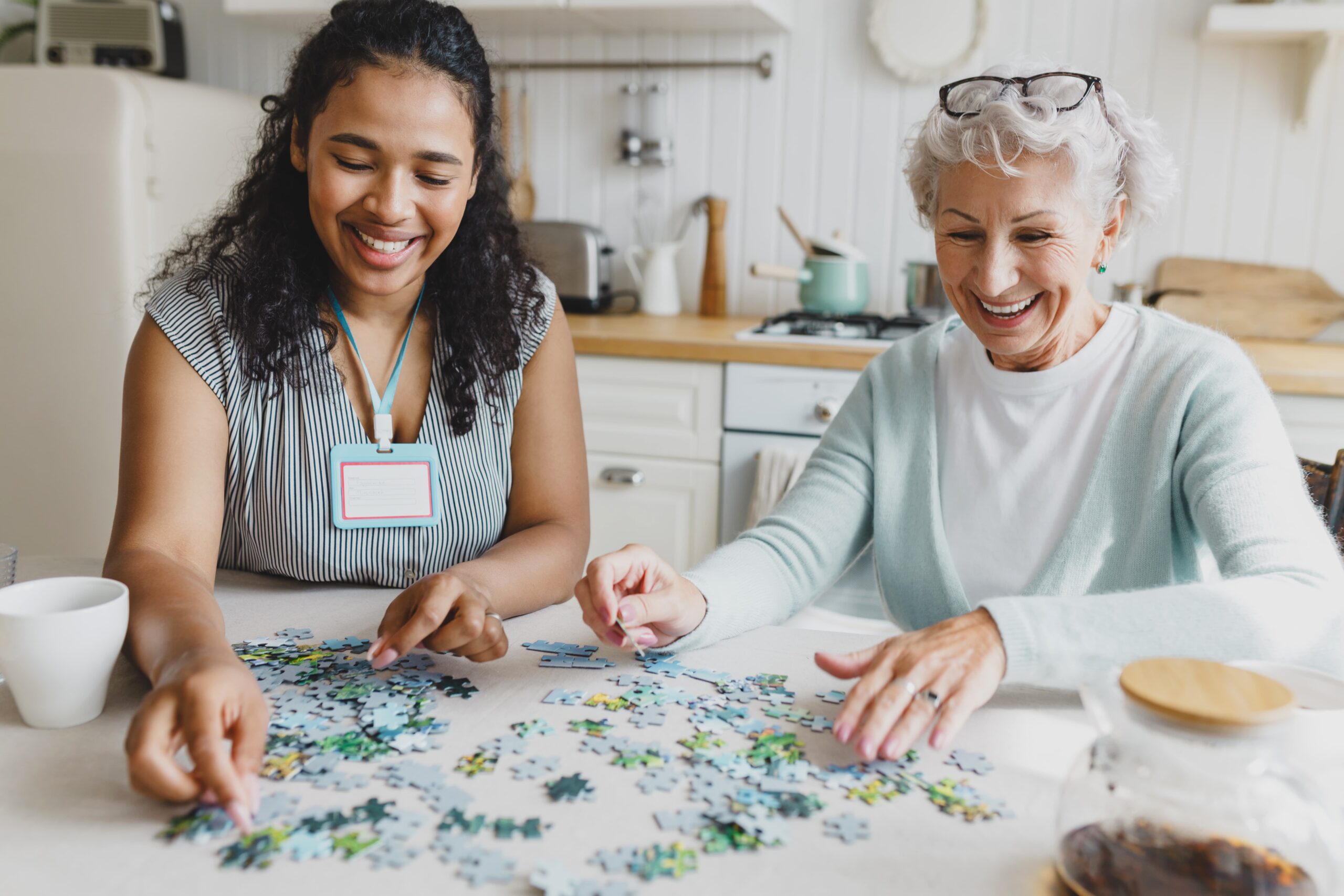 Residents and staff enjoying a puzzle activity together