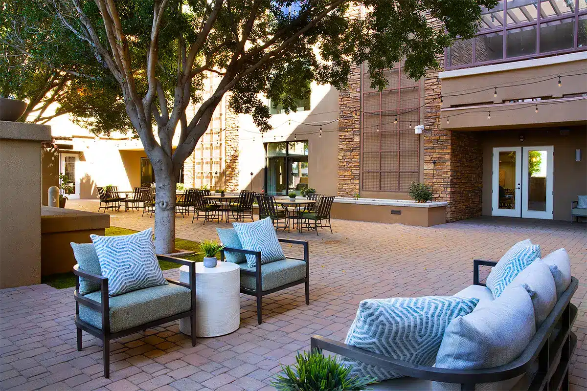 Outdoor seating area with patio furniture and landscaping
