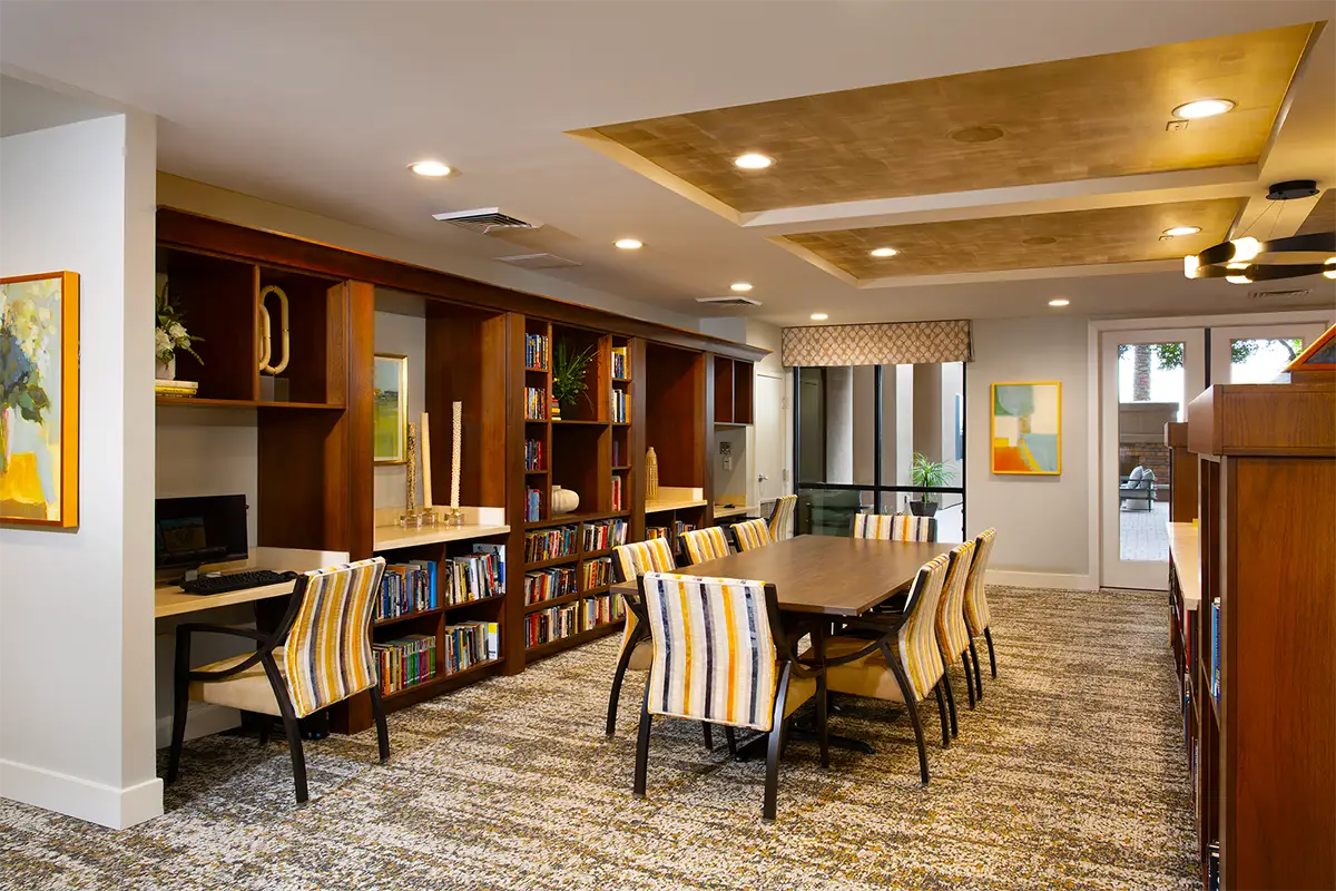 Interior common area with seating and bookshelves