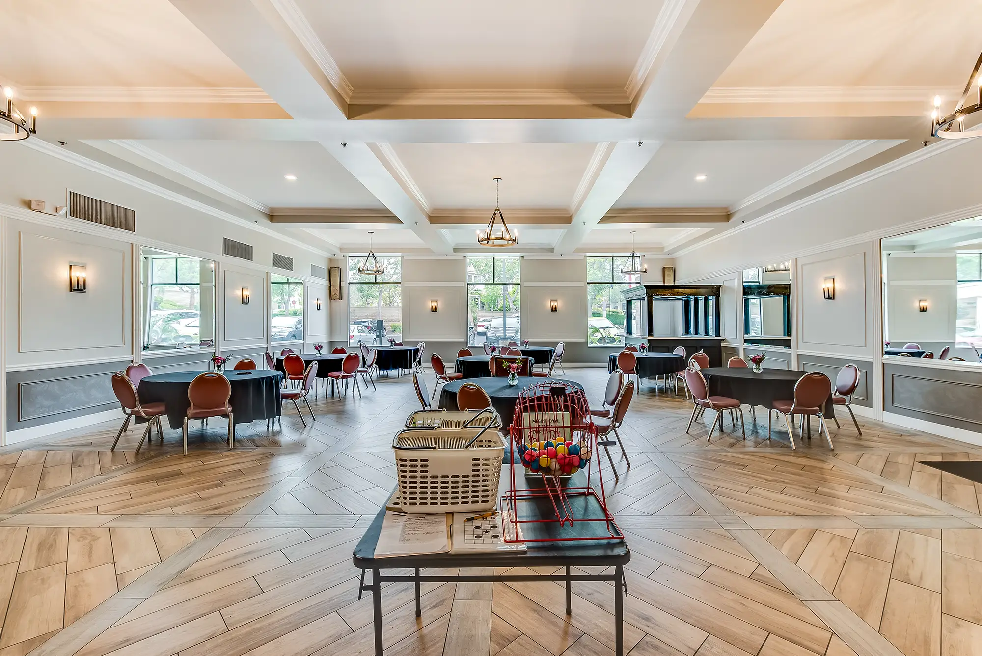 Bright common area with tables and chairs arranged