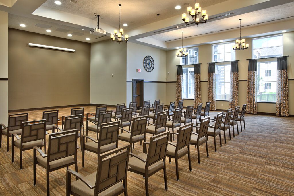Interior view of an empty activity room with chairs arranged