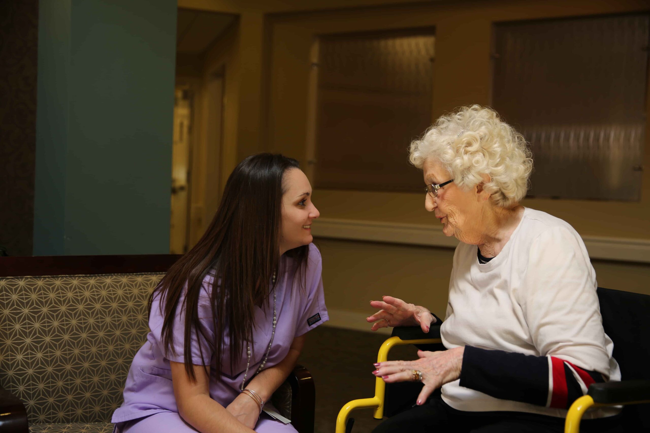 Staff member engaging in conversation with a resident