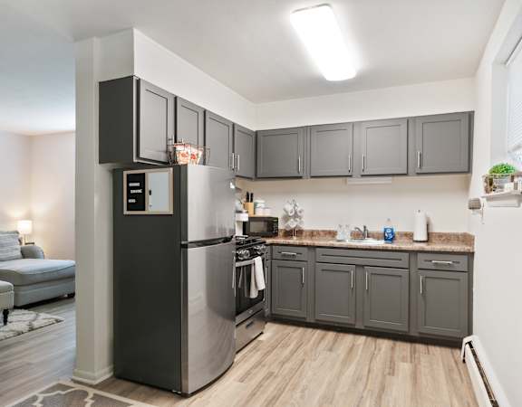 Modern kitchen area with appliances and cabinets