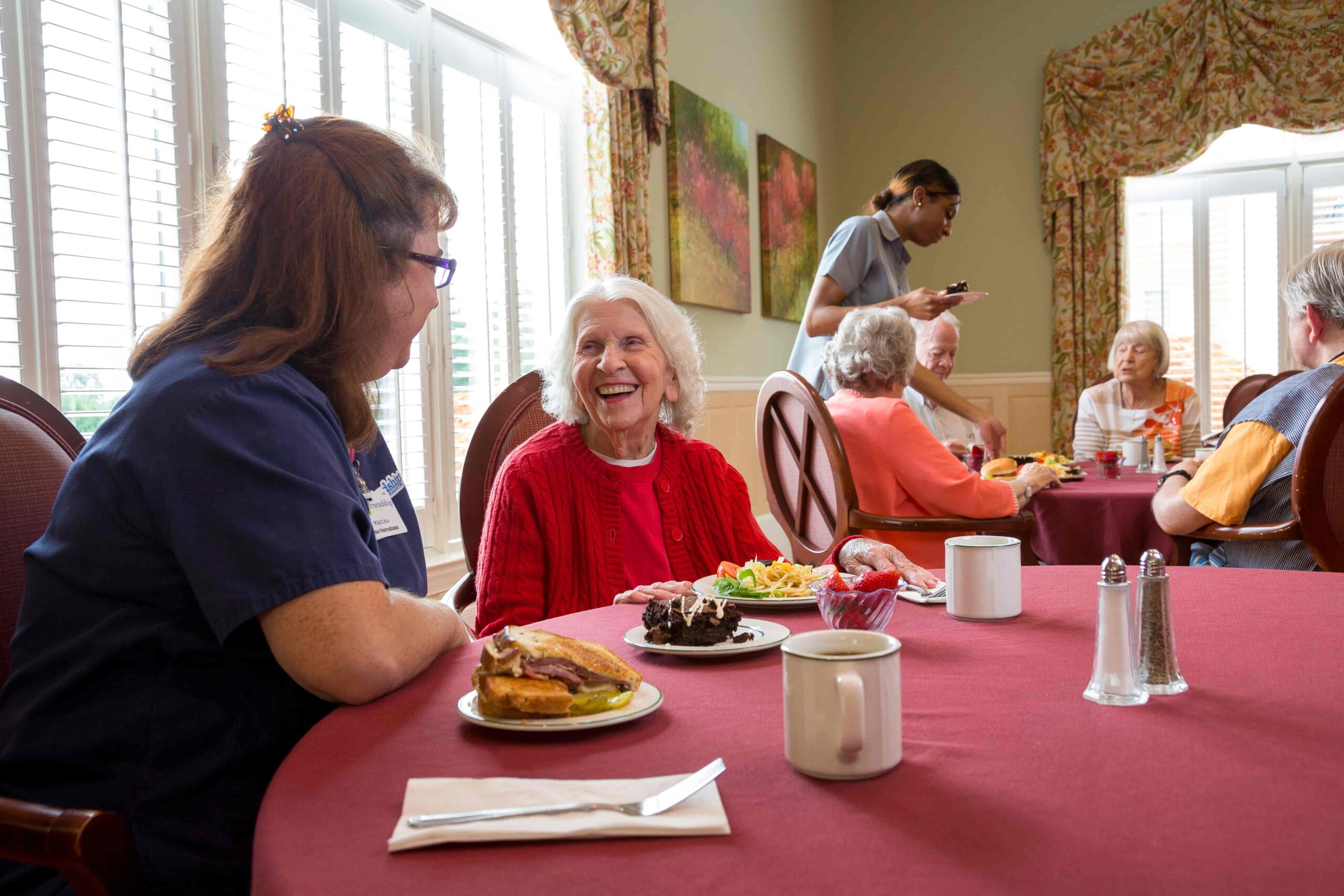 Residents enjoying a meal in the dining area
