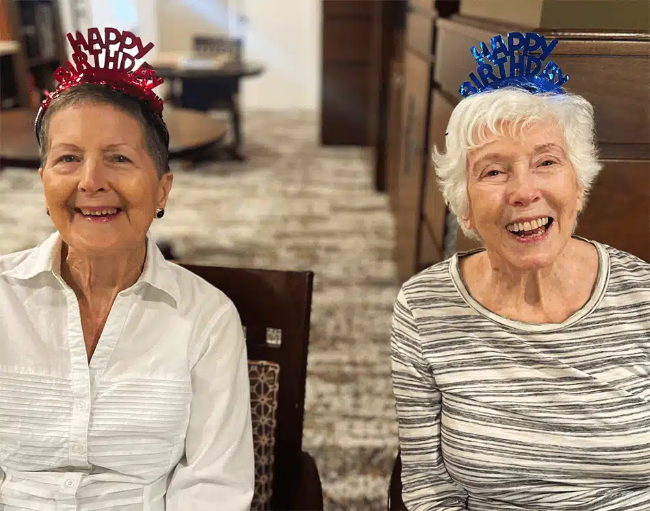 Two residents celebrating a birthday in the common area