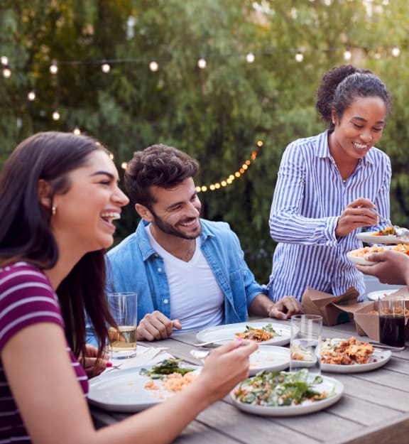 Residents enjoying a meal and laughter together