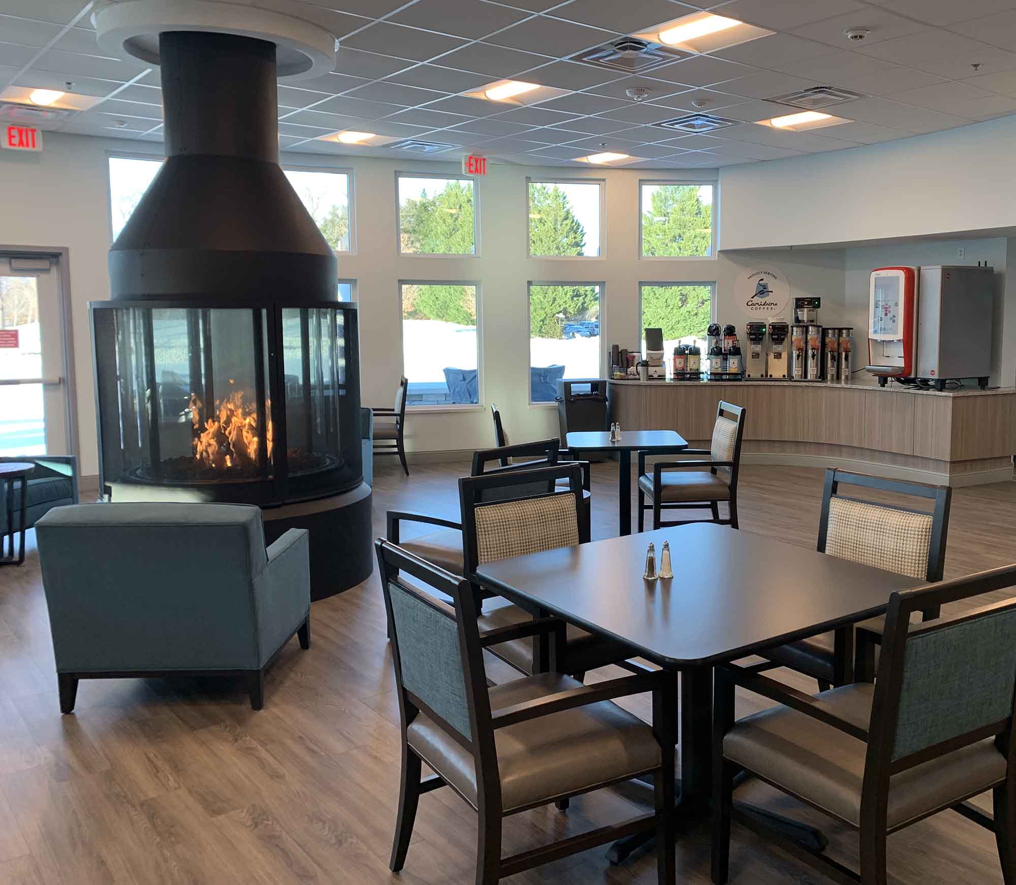 Bright interior common area with modern seating and fireplace
