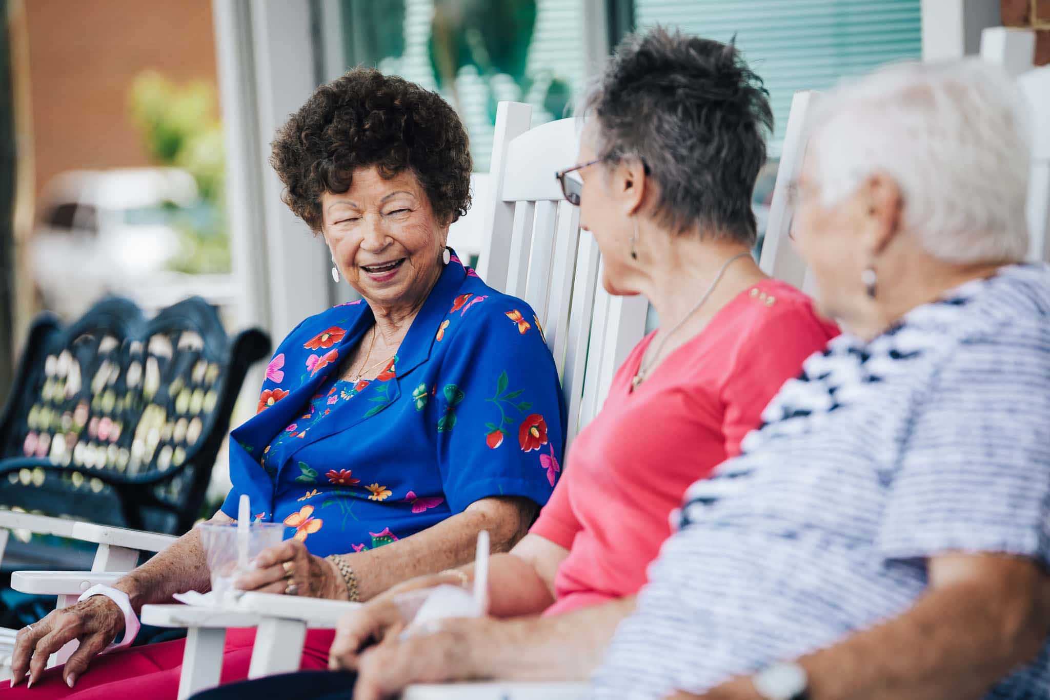 Residents enjoying conversation on a porch