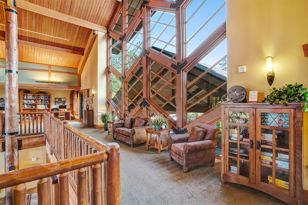 Common area with large windows and cozy seating