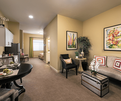 Cozy resident room with dining setup and art decor