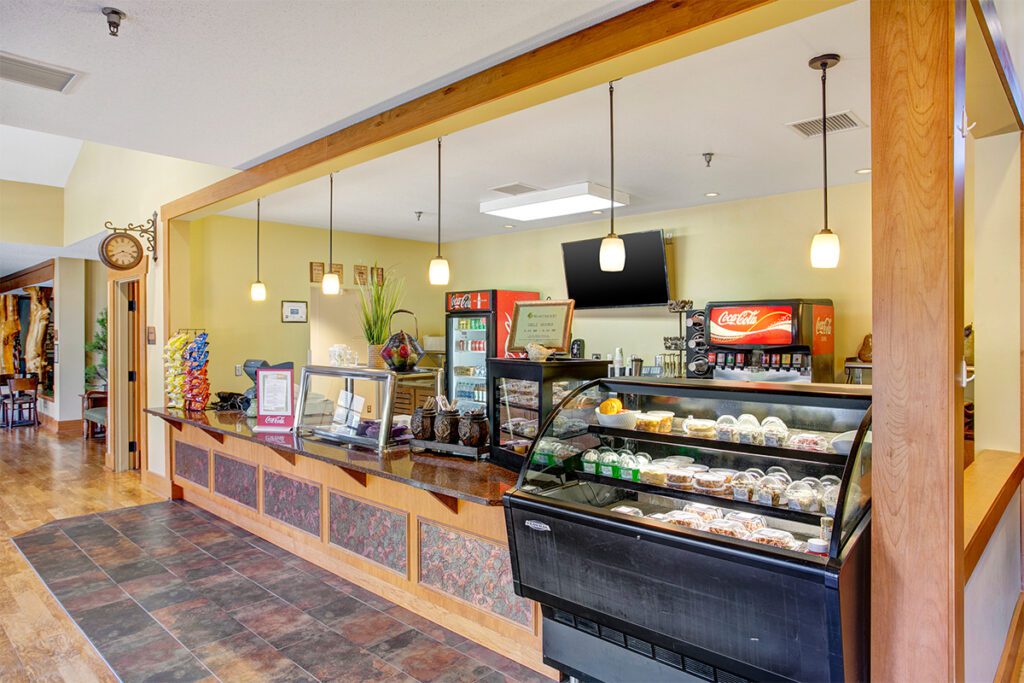 Interior view of a cafe area with food display