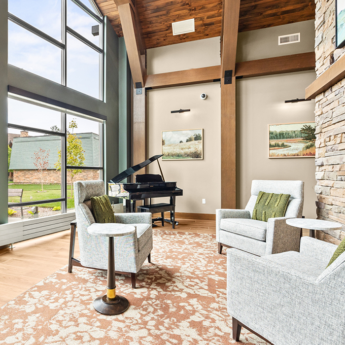 Bright common area with a piano and seating