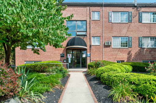 Exterior view of a senior living facility with landscaping