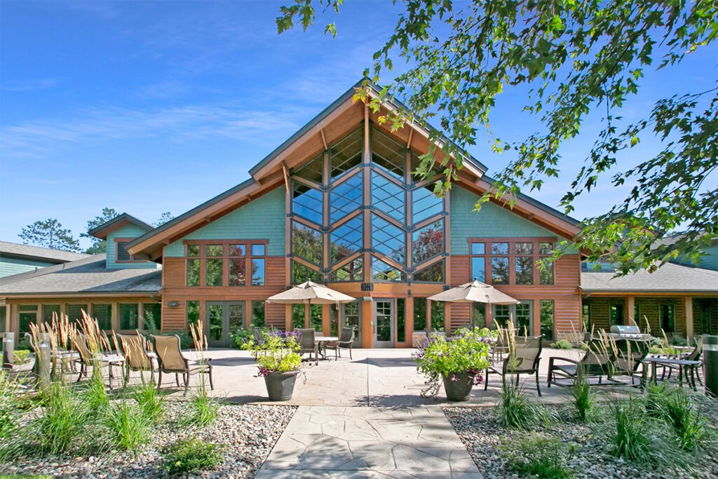 Exterior view of the Fairway Knoll facility with patio seating